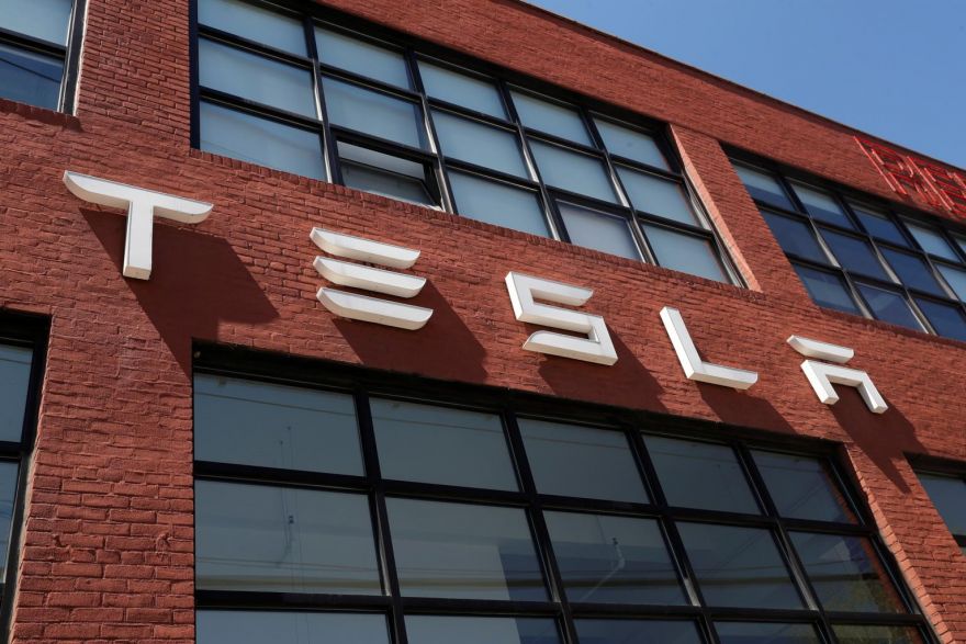 Tesla reports higher profits, says expansion on track